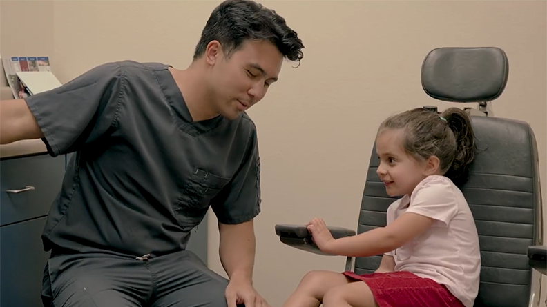 Dr. Hoffman sees a pediatric patient before school starts.